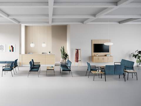 A group of Easton seating products with a Patient Chair and Side Chair in green upholstery and black frame and a three-seat Multiple Seating and Easy Access Chair in blue upholstery and silver frame.