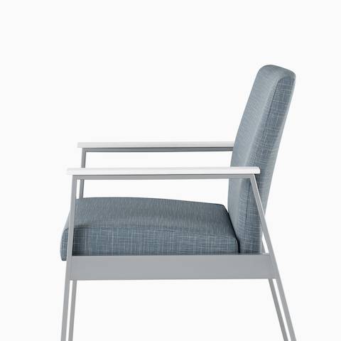 Side view of an Easton Side Chair with blue upholstery, metallic silver four-leg base, and glacier white Corian arm caps.