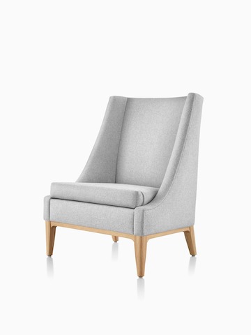 Angled front view of an Iris Lounge Chair in a light gray textile with an oak base. Select to go to the Nemschoff Iris Lounge Chair product page.