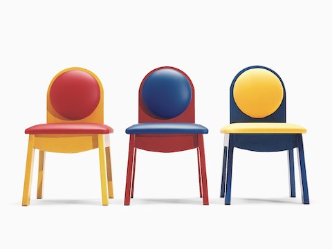 Three Nemschoff Junior 200 Side Chairs in a combination of red, yellow, and blue, viewed from the front.
