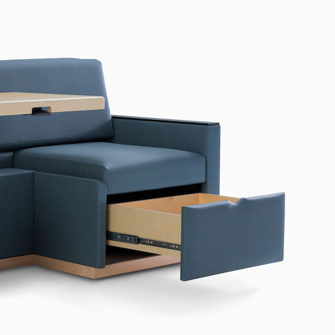 Nemschoff Merge 2 Flop Sofa in dark blue textile with light wood table and black solid surface arm caps.