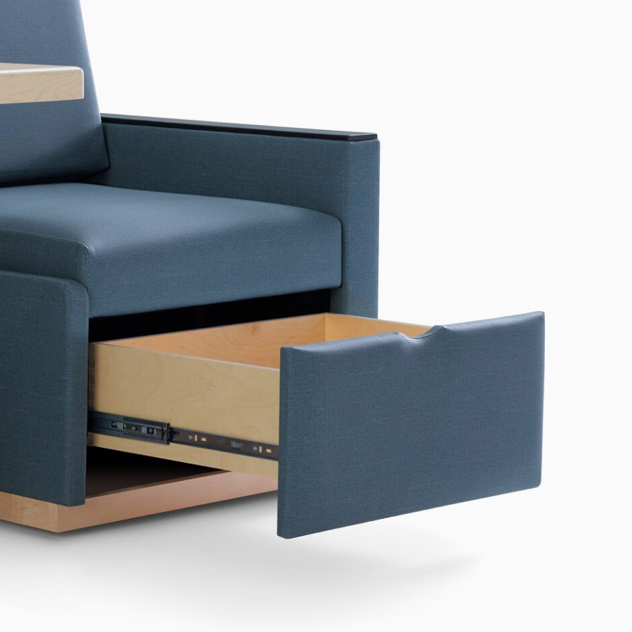 Nemschoff Merge 2 Flop Sofa in dark blue textile with black solid surface arm caps and a storage drawer in the open position.