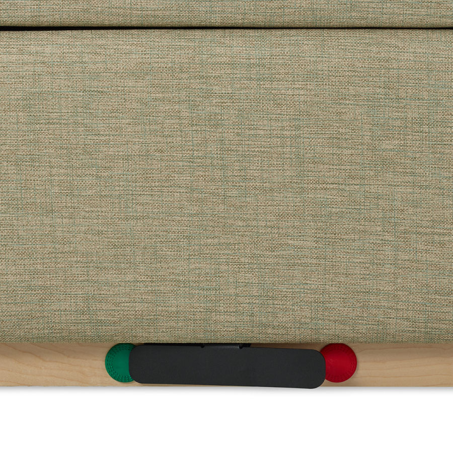 Detail of the brake and caster system on a Nemschoff Merge 2 Flop Sofa in a beige upholstery with a natural maple base.