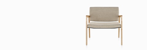 A Monarch Plus Chair in tan textile with solid hardwood frame and wood arm caps.