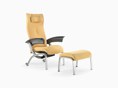 Nemschoff Nala Patient Chair in a yellow upholstery with a headrest pillow and dark gray arms viewed on white sweep at an angle.