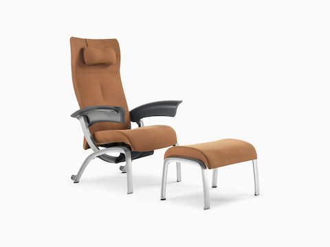 Nemschoff Nala Patient Chair in a brown upholstery with a headrest pillow and dark gray arms viewed on white sweep at an angle.