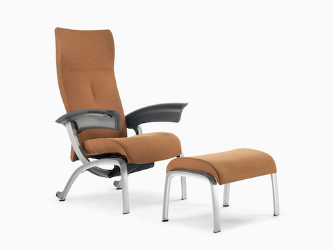 Nemschoff Nala Patient Chair and Ottoman in a brown upholstery with dark gray arms with a silver frame and legs.
