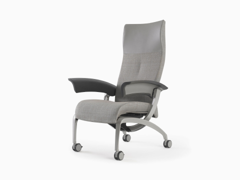 A Nemschoff Nala Patient Chair in gray textile with dark gray urethane arm pads. A Nemschoff Nala Patient Chair in gray textile with dark gray urethane arm pads.