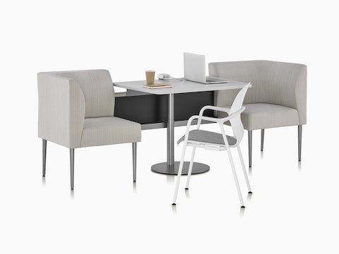 Two seat Nemschoff Palisade Booth in a patterned beige upholstery and a center table in a white surface and a Logic power access unit on it, with a Keyn side chair.