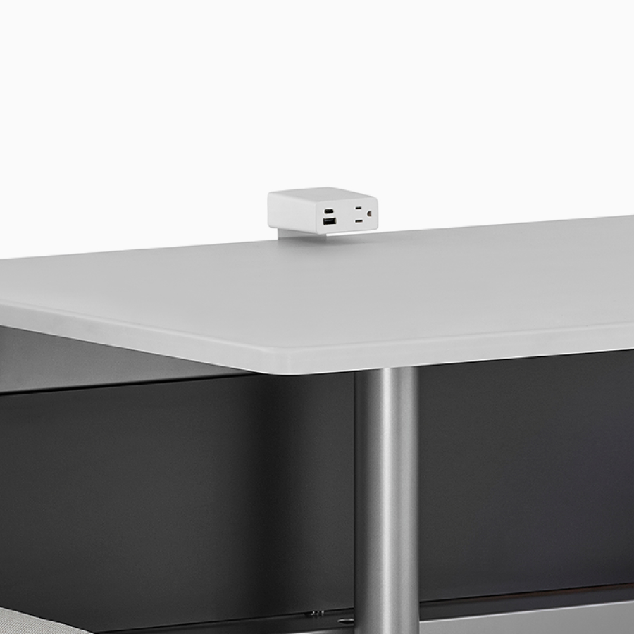 Logic power access unit on the center table surface of a Nemschoff Palisade Booth.