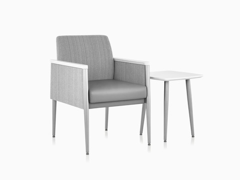 Palisade Chair in gray fabric with white side table.