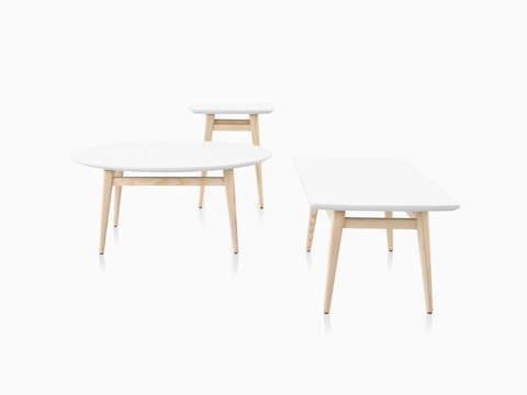 Group image of white Palisade Coffee Tables with wood legs.
