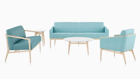 Palisade lounge seating in turquoise fabric and wood legs and Occasional Tables on white sweep.