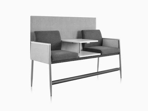 Three-quarter view of Nemschoff Palisade Easy Access Multiple Seating with privacy screen, with solid surface center table and power module.