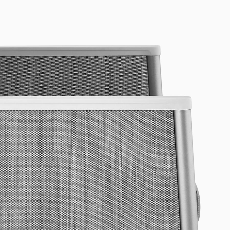 Detail of Nemschoff Palisade Easy Access Multiple Seating in a gray upholstery and white solid surface arm caps.
