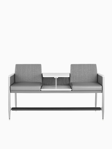 Front view of Nemschoff Palisade Easy Access in a gray upholstery with a height-adjustable center table in white, on white sweep.