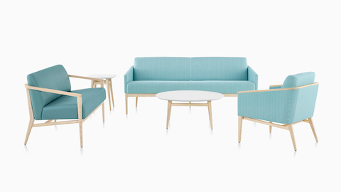 A Palisade Lounge Chair and lounge seating in turquoise fabric, with a white coffee table.