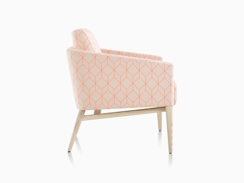 Three-quarter view of Palisade Lounge Chair in tan and pink fabric with wood frame.