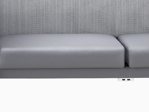 Cropped view of Nemschoff Palisade Multiple Seating focused on the cushion and back surface and power module.