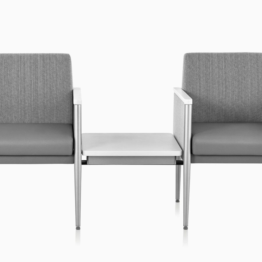 Detail of a Nemschoff Palisade Multiple Seating single seat on each side of a center height-adjustable table surface in the down position.