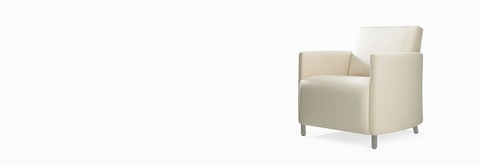 A three-quarter view of a Pamona Armchair in a white upholstery. A three-quarter view of a Pamona Armchair in a white upholstery.