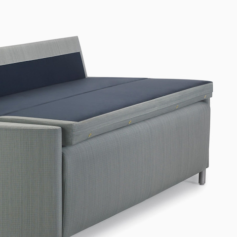 Nemschoff Pamona Flop Sofa in a gray upholstery with the sleep surface open, viewed from an angle.