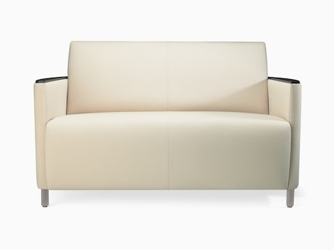 A Pamona Sofa in white textile with metal legs and black urethane arm caps.