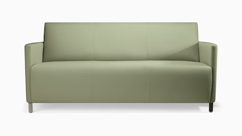 A Pamona Sofa in green textile with metal legs.