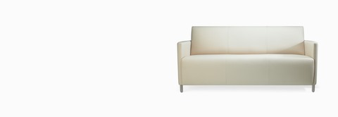A Pamona Sofa in white textile with metal legs. A Pamona Sofa in white textile with metal legs.