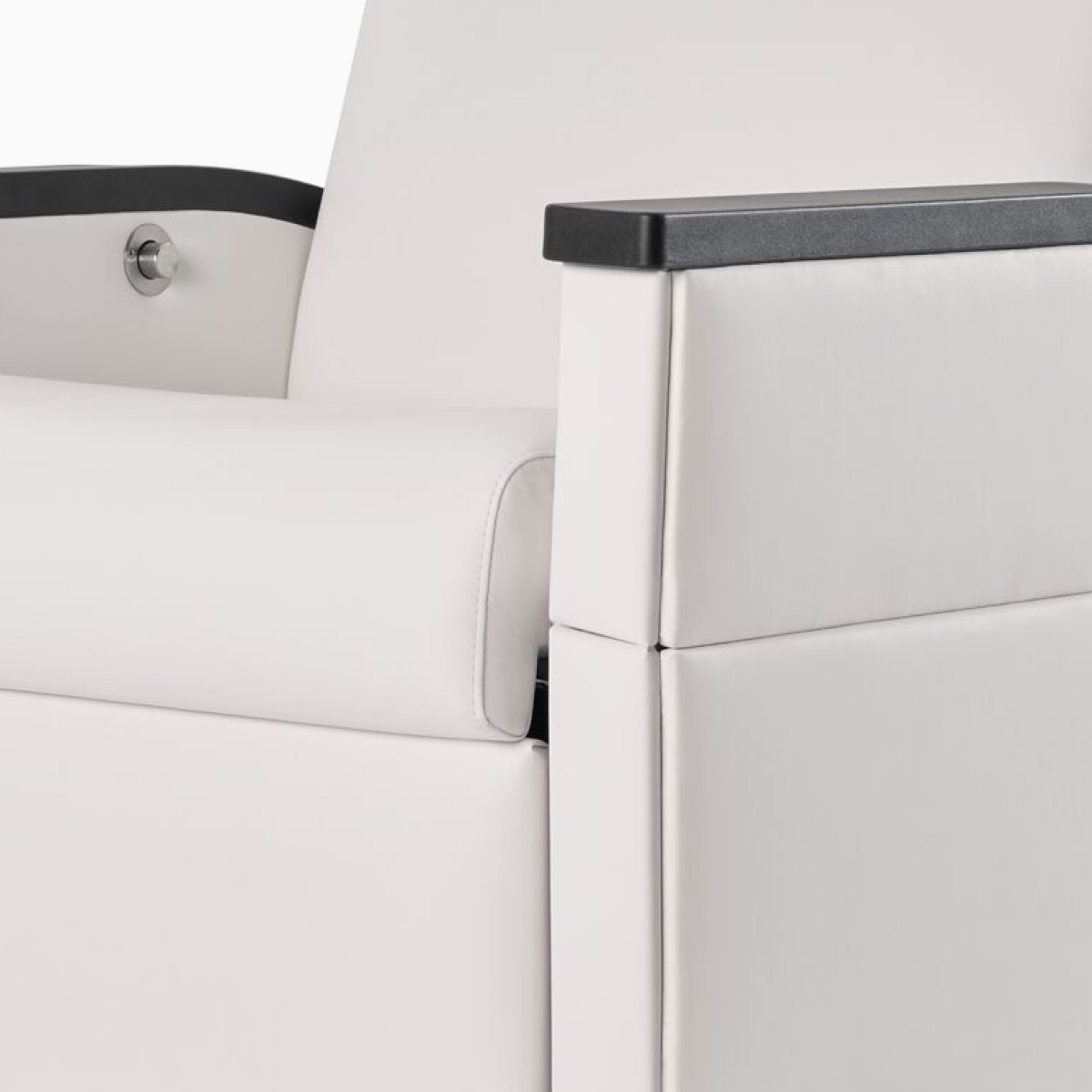 Close-up of removable covers on Nemschoff Pristo Recliner arms in a white upholstery.