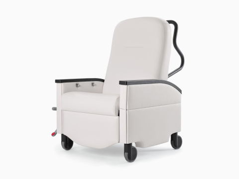 Three-quarter view of a Nemschoff Pristo Recliner in a white upholstery with black arm caps and wheels.