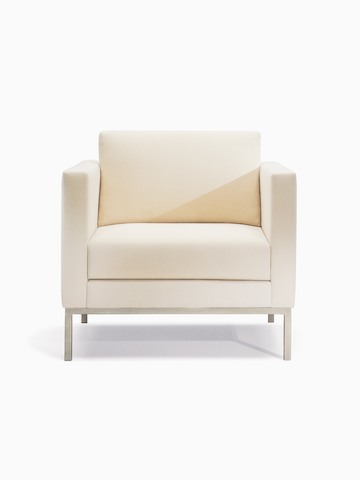 A Riva Armchair in light textile with brushed metal legs.