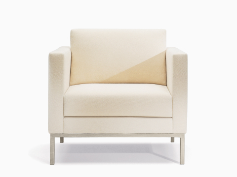 A Riva lounge chair in light textile with brushed metal legs.