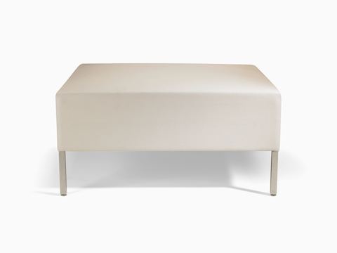 A Riva lounge bench in a light-colored textile with brushed metal legs.