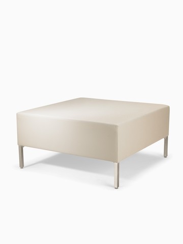 A Riva Bench in a light-colored textile with brushed metal legs.