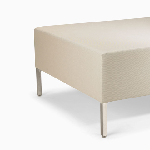 A Riva Bench in light textile with brushed metal legs.