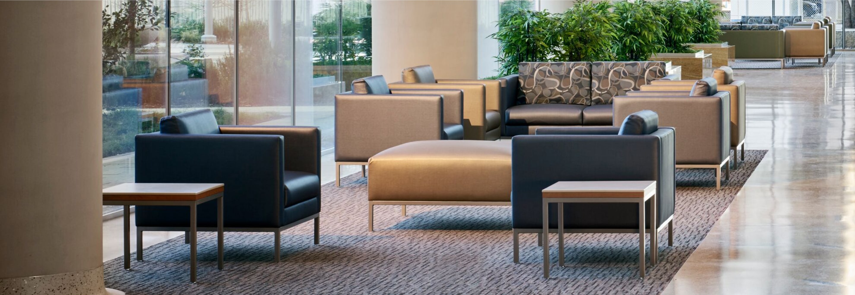 A window filled waiting area featuring Nemschoff Riva Armchairs, Sofas, and Side Tables.