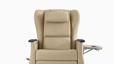 Front view of Nemschoff Serenity Recliner with optional accessory table extended.