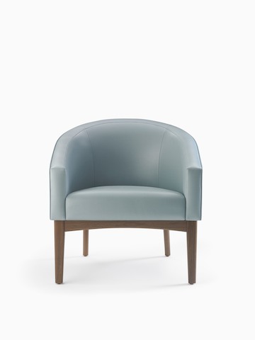 A Sophora Lounge Chair in light blue textile with a walnut base and legs.