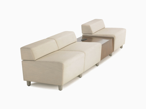 Three Nemschoff Steps Lounge System straight seats in a cream upholstery with a medium wood in-line table.