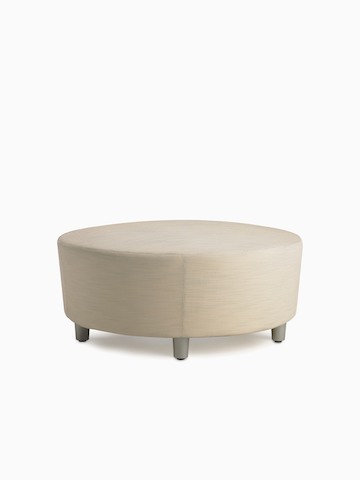 A Steps Lounge System Ottoman in a light-colored upholstery.
