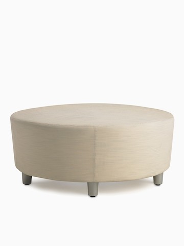 A Steps Lounge System Ottoman in a light-colored upholstery.
