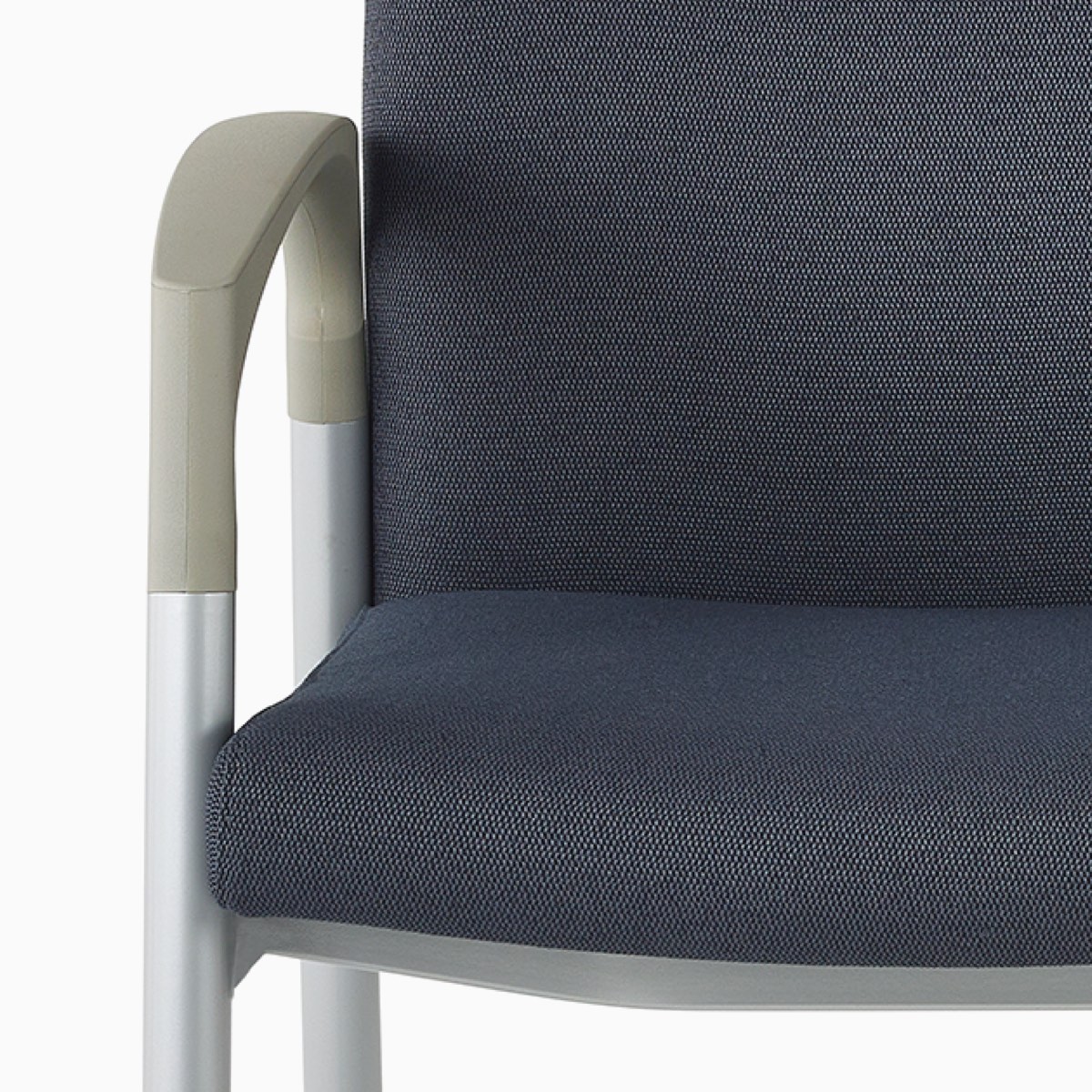 Detail of a Valor chair contoured arm and armcap.