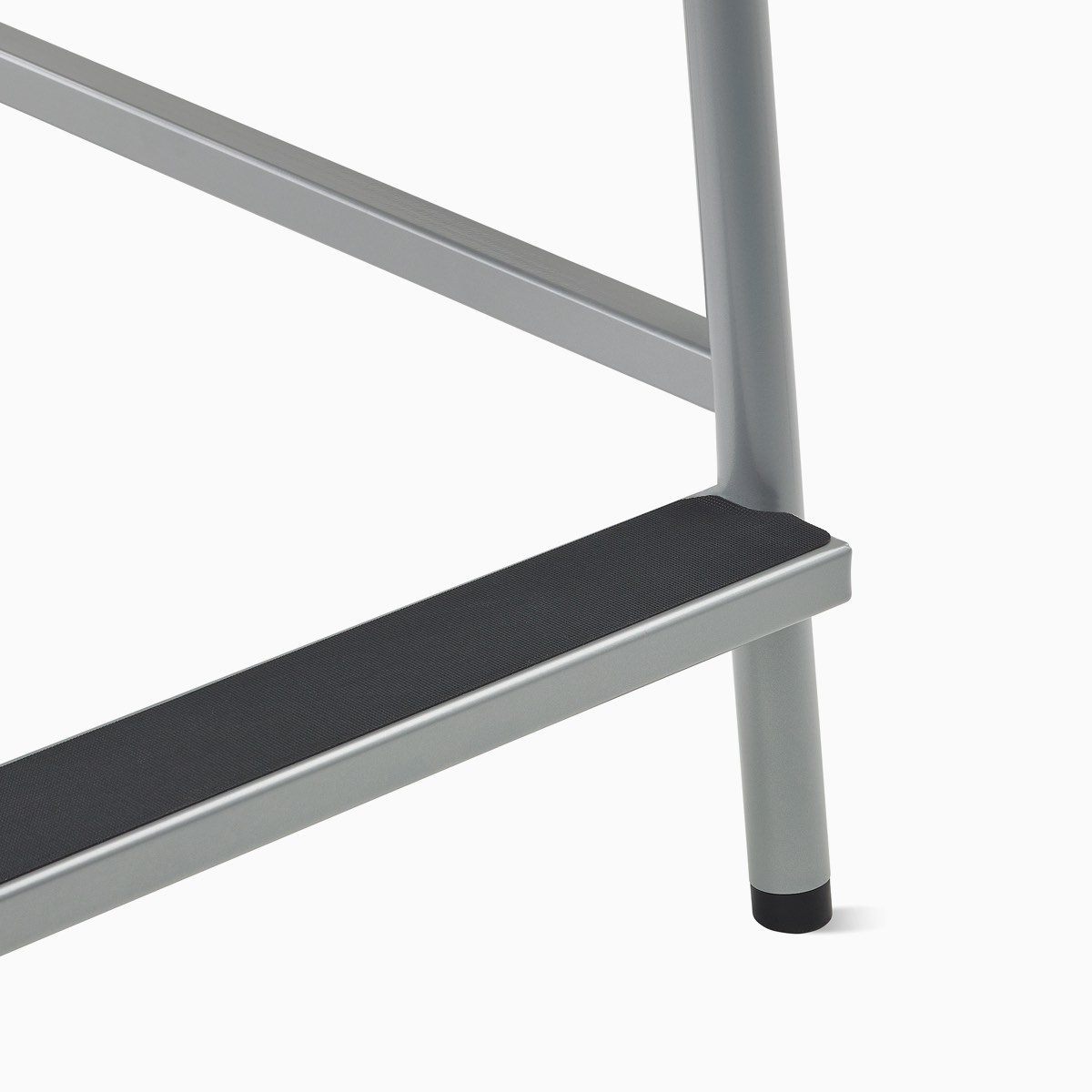 Detail of the footrest on a Valor Easy Access Chair with a silver frame and black grip on the footrest.