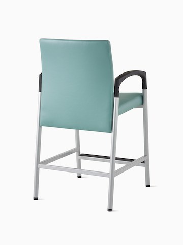 Three-quarter, back view of a Valor Easy Access Chair in a blue-green upholstery with a silver frame and black armcaps.