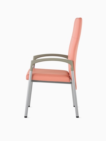 Side view of a high-back Valor Patient Chair in a salmon pink upholstery and silver frame with pewter armcaps.