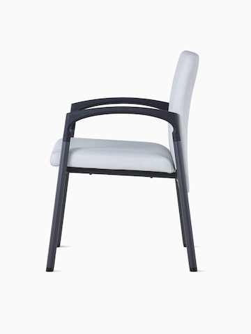 Side view of Valor Side Chair in a light gray upholstery on the back and seat and a black metal frame.