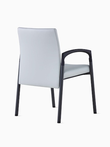 Three-quarter, back view of Valor Side Chair in a light gray upholstery on the back and seat and a black metal frame.