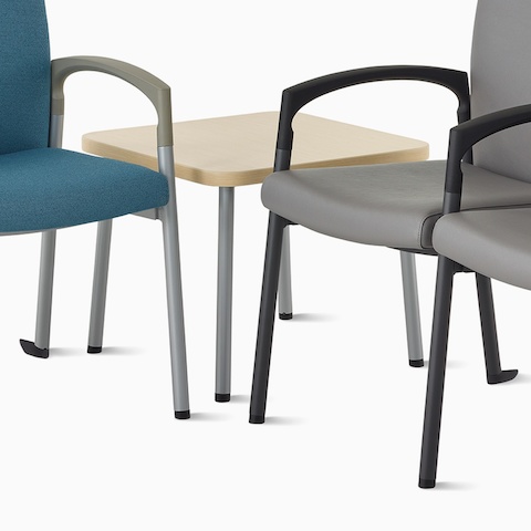 Valor two-seat multiple seating in blue with a silver frame, along with a Valor three-seat multiple seating in dark gray with black frame, and a Valor Side Table in ash wood laminate top and silver frame.