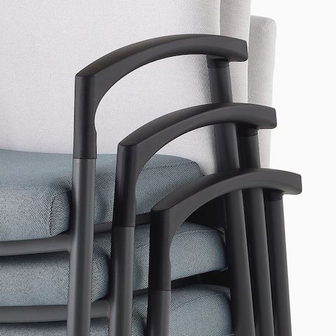 Detail of the Valor Stacking Chair with arms stacked three high.